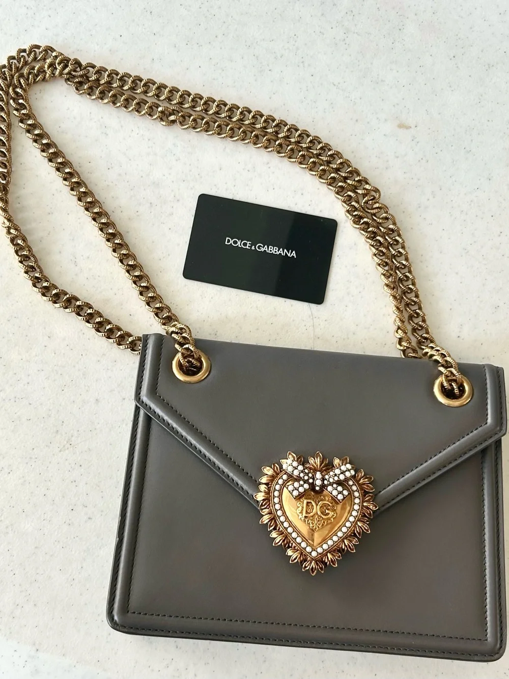Dolce & Gabbana Gray Leather Shoulder Bag with Gold Heart Emblem.